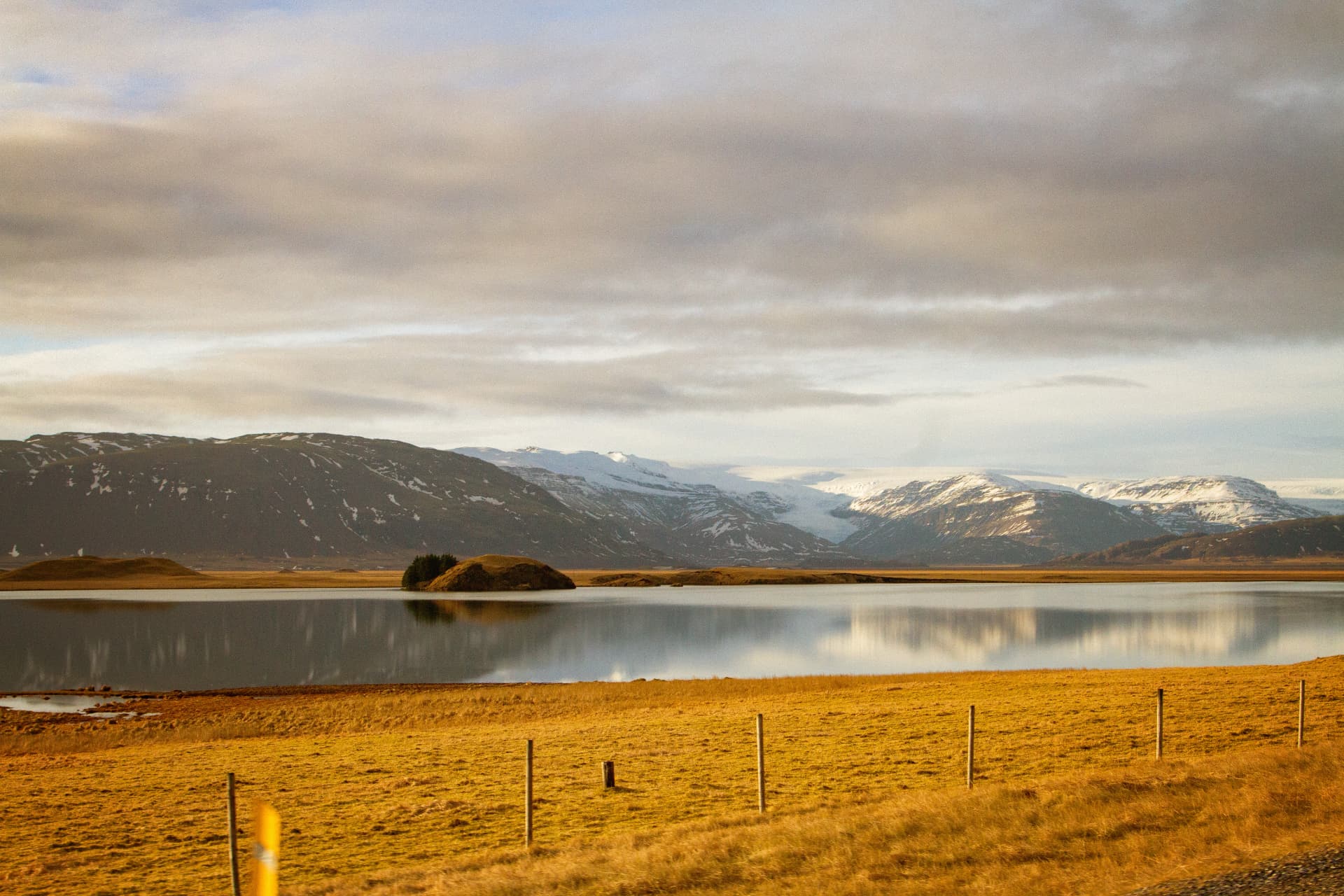 Lake and snow-capped mountains at golden hour